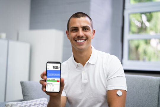 Man Using Continuous Glucose Remote Monitor