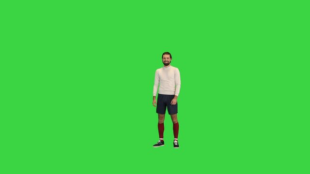 Football player giving a pass on a Green Screen, Chroma Key.