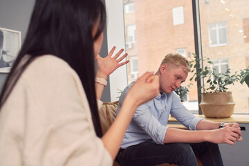 Multiracial couple having argument during psychotherapy session