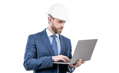 businessman man in suit and safety helmet wotking on laptop online isolated on white, work online.