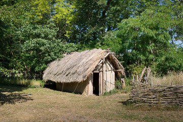 Fototapeta na wymiar Medieval wooden house. Replica in the nature.