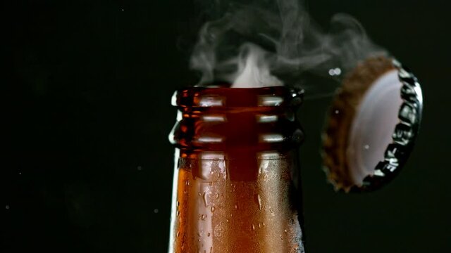 Super slow motion of opening beer bottle. Filmed on high speed cinema camera, 1000 fps.