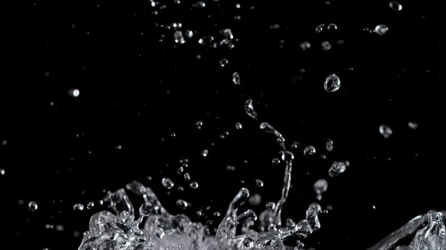 Super slow motion of water splash on black background. Filmed on high speed cinema camera, 1000 fps.