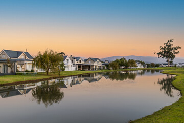 Fototapeta na wymiar Houses on lakeside in a beautiful golf estate in Robertson South Africa