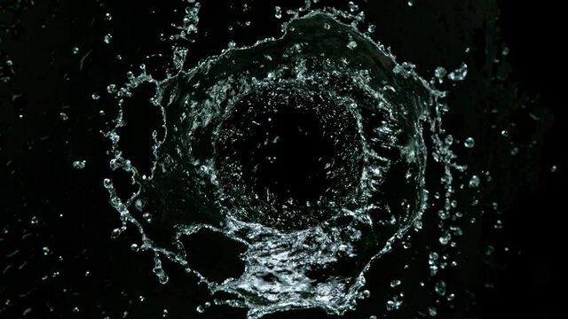 Super slow motion of rotating water on black background. Filmed on high speed cinema camera, 1000 fps.