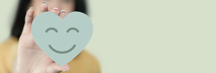 Woman hands holding paper cut heart shape, family insurance, CSR, world heart day, health care, love, organ donation, world health day, wellbeing, gratitude, be kind, be thankful, praying concept	
