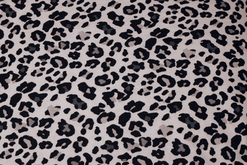 Fabric background with the image of various dark and light spots, like the skin of a leopard or cheetah