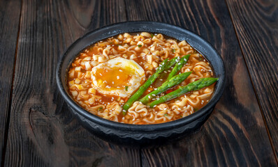 Bowl of ramen with soft-boiled egg and asparagus