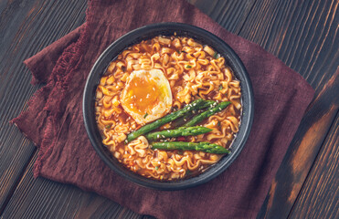 Bowl of ramen with soft-boiled egg and asparagus