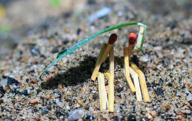 Matchstick art photography used matchsticks to create the character. Couple enjoying the rain. Matchstick couple.