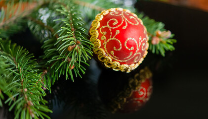 Christmas tree branches with a glass Christmas tree toy. Christmas concept, winter. Background for postcards.	