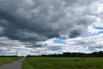 A country road under a cloudy sky, Québec