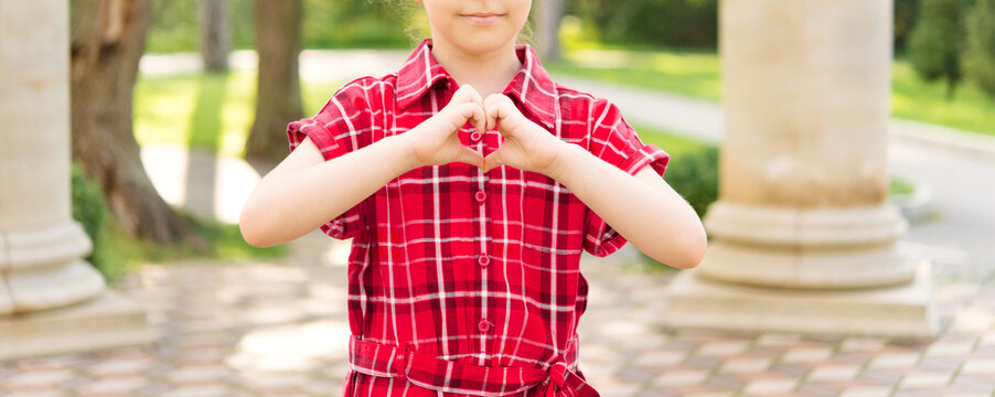 child makes heart shaped hands, heart health insurance, social responsibility, charitable donation, world heart day, appreciation, world mental health day, end of asian hate concept