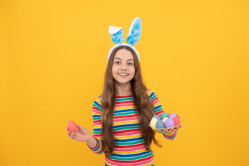 happy easter kid girl in rabbit bunny ears hold colorful eggs for holiday, easter bunny