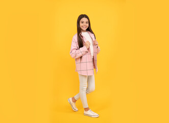 happy child girl wear pink checkered shirt, tween