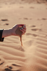 young girl hands playing with some sand