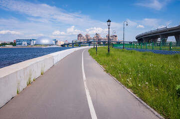 Asphalt bike path on the embankment, Krestovsky Island, St. Petersburg, Russia