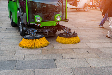 Street Sweeper car is cleaning machine in the park.Municipal car for  cleaning and brush roads or...
