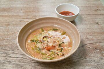 boiled seafood sukiyaki in soup with sauce