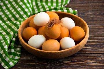 raw eggs on wooden background