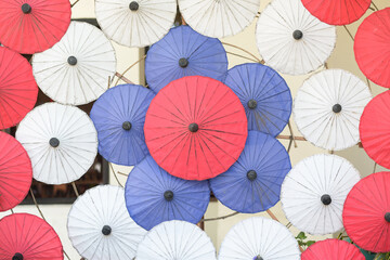 Many paper umbrellas lined up colorful