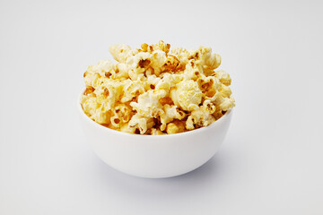 popcorn in white plate isolate on white background