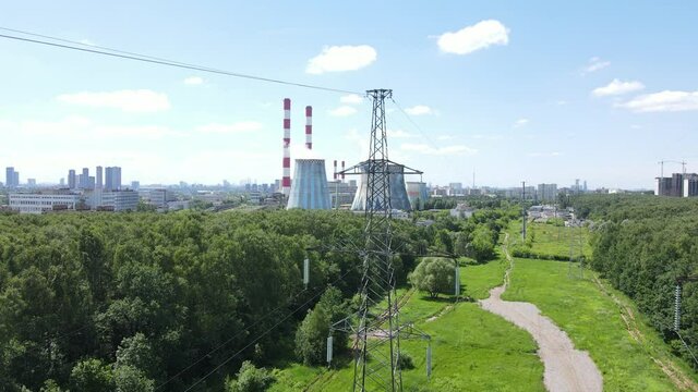 Aerial drone view of high voltage tower and thermal power station.