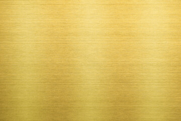 Shiny gold polished metal background texture of brushed stainless steel plate with the reflection...