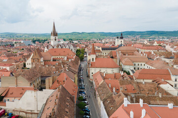 Aerial view of ancient part of Sibiu in Romania, red roofs town in summer day