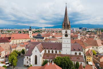 Fototapeta premium Aerial view of ancient part of Sibiu in Romania, red roofs town in summer day