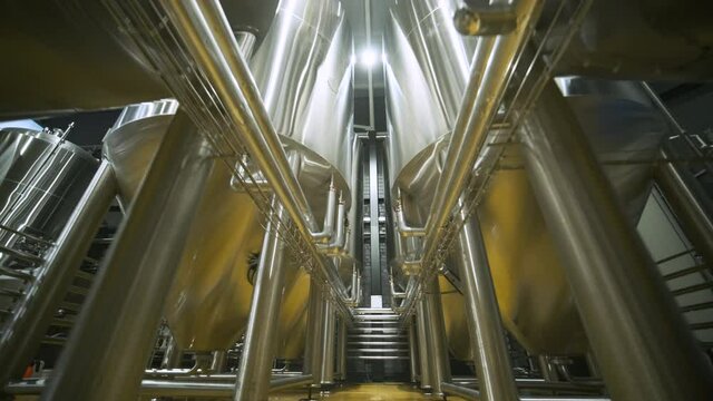 Modern craft brewery. Craft beer production. Modern equipment in brewery, metal tanks, alcoholic drink production