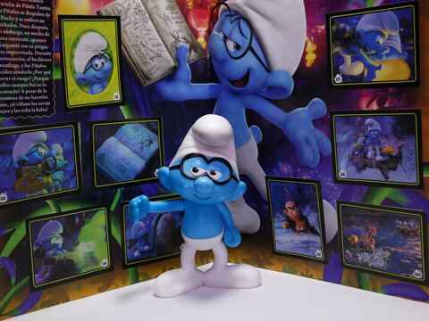 The smurfs. Philosopher. Little blue creatures that live in mushroom houses in the woods. Television characters, movies and comics. Album of figurines or stickers.
