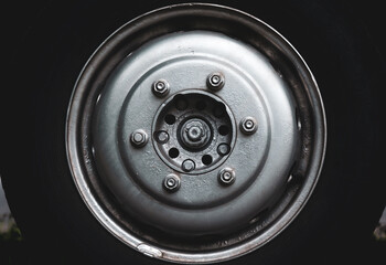 A truck wheel, close-up, with a silver disc.