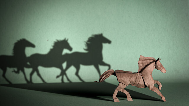 The concept of leadership, teamwork, focus and achievement of goals. A paper horse figurine that casts the shadow of a herd of horses. 3D illustration