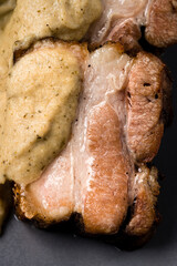 stew of pork belly with apples, onion and sugar, classic dish from Denmark Ebleflask pork brisket