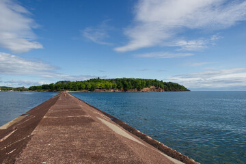 View of an island from on top of a seawall