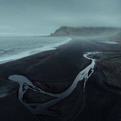 Aerial drone view of beautiful nature dramatic landscape in Iceland. Low clouds, fog on the...
