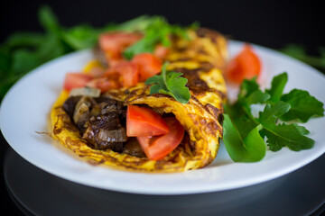 fried egg omelet with wild mushrooms and tomatoes