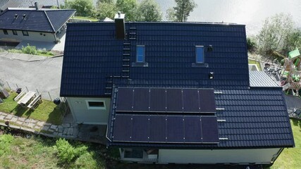 Solar energy adoption at rural western Norway - Stamnes outside Bergen - Aerial showing modern stylish solar panels on roof of private home