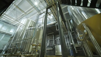 Modern craft brewery. Craft beer production. Modern equipment in brewery, metal tanks, alcoholic drink production