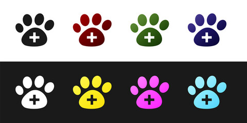 Set Veterinary clinic symbol icon isolated on black and white background. Cross hospital sign. A stylized paw print dog or cat. Pet First Aid sign. Vector