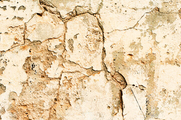 Texture of a concrete wall with cracks and scratches which can be used as a background