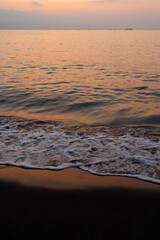 Red sky and peaceful sea at sunset