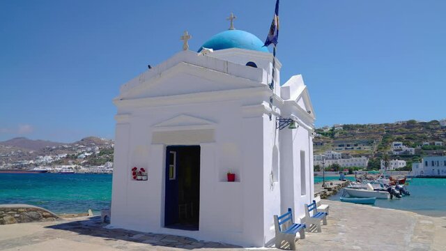 Whitewashed and blue domed Agios Nikolaos church in the Old Town of Mykonos, Greece