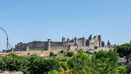 Fortified City of Carcassonne on a hill in France with its tall blue-roofed towers and gates