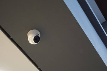 CCTV cameras are small and attached to the roof, to monitor a room in the security system    