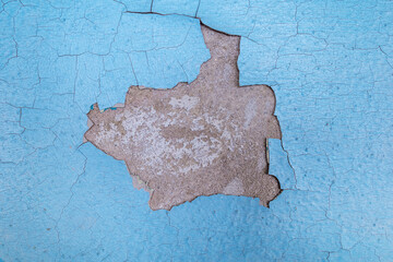 Old cracked blue paint on a cement wall. For design.