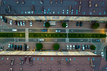 Aerial view of the road between houses at sunset