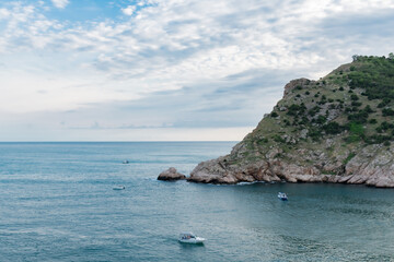 Fototapeta na wymiar Rock in the sea bay. Sea bay rock view. Landscape of sea bay 