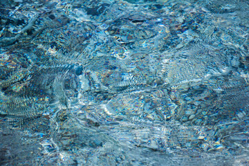 Magic blue caustics on the sea surface
